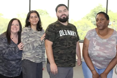 Four NetTEL USA staffers at the headquarters.